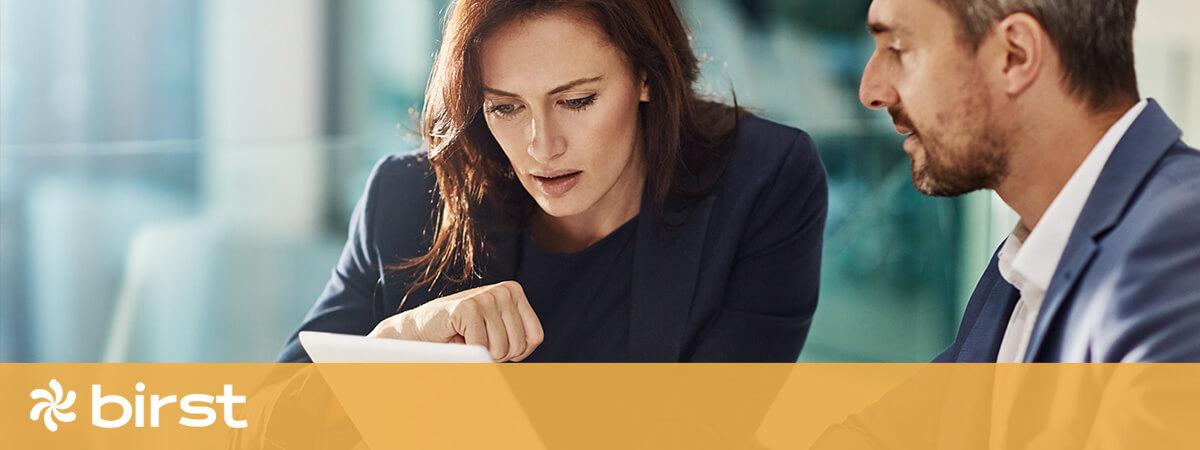 Two business people viewing a electronic tablet
